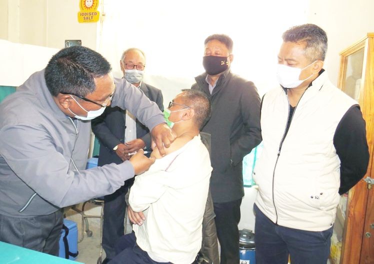 SMO Dr Nosezol Sezo gets the first COVID-19 vaccine shot during the launching programme held at Community Health Center, Medziphema on January 18. Dr Sezo in the presence of ADC Thuvisie Phoji, SDO (C) Tokai Sumi, HCMC Chairman, Rev Terhujah and Government officials and health workers launched the vaccination drive. Altogether, 26 beneficiaries were registered for the first vaccination drive. Vaccination programme was held in one session at CHC, where different terms were divided into 3 rooms, the waiting rooms, the vaccination room and the observation room where beneficiaries were kept for 30 minutes, all assisted by vaccination officers. (DIPR Photo)